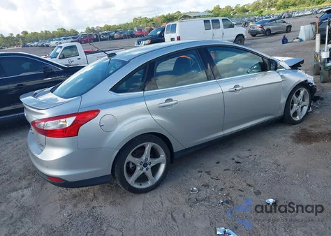 2014 Ford Focus Titanium z USA, uszkodzony, nr VIN 1FADP3J27EL463120